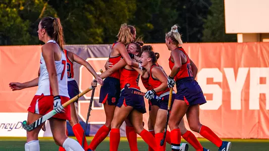Syracuse field hockey celebrates a goal against Cornell