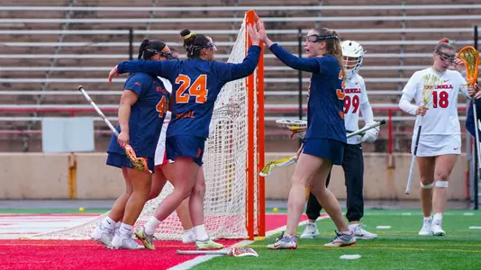 The Orange celebrate a goal against Cornell.