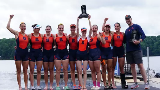 ACC Champion varsity 8 on podium