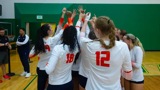 Volleyball huddle vs. NJIT