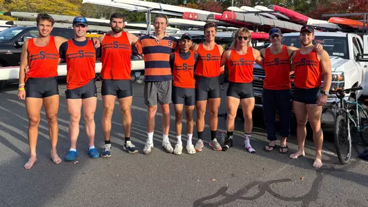 Syracuse men's rowers stand after competing at the 60th Head of the Charles Regatta