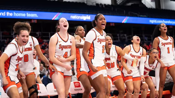 WBB team celebrating on the bench