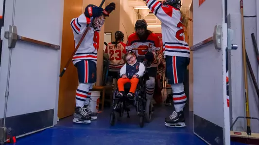 Emmy Entering the Ice with Team