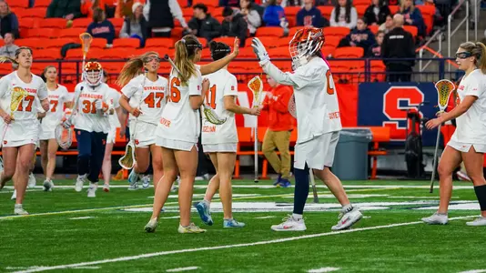 The Orange celebrate their win against Cornell.