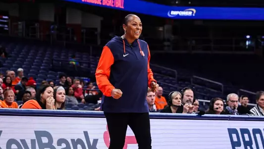Felisha Legette-Jack smiles on the sidelines