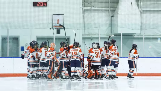 Syracuse ice hockey huddle vs. Kingston