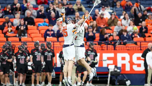 Syracuse celebrates a goal against Saint Joseph's