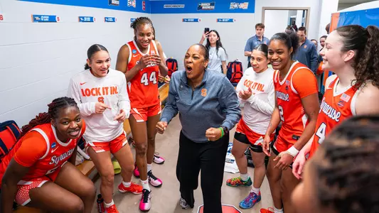 Syracuse head coach Felisha Legette-Jack celebrates in the locker room with her team