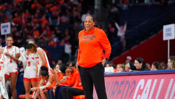 Felisha Legette-Jack smiling on the sidelines