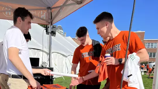 Marketing table at 'Cuse on the Quad