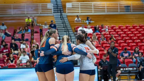 Volleyball Team Huddle vs. Cornell