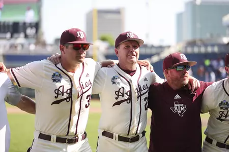 OMAHA, NE - June 19, 2022 - Assistant Coach Nolan Cain of the Texas A&M Aggies and Head Coach Jim Schlossnagle of the Texas A&M Aggies during the NCAA Baseball College World Series game between the Texas Longhorns and the Texas A&M Aggies at Charles Schwab Field in Omaha, NE. Photo By Kate Luffman
