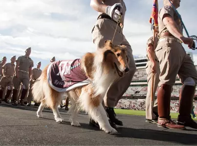 Corps to March at Friday Soccer Match