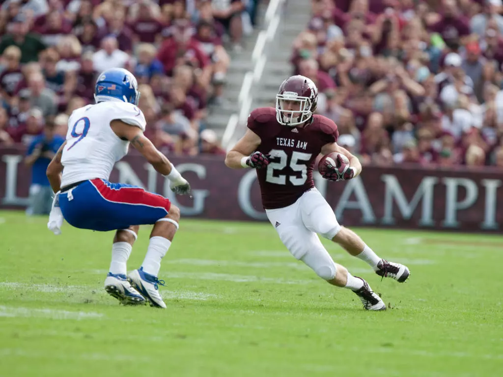 Aggies Bowl Eligible After 61-7 Kansas Rout