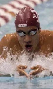A&M's Nel Strikes Gold; Enriquez Breaks Fourth School Record
