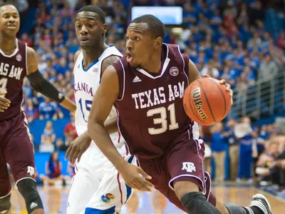 Aggies Fall at No. 5 Kansas, 64-54