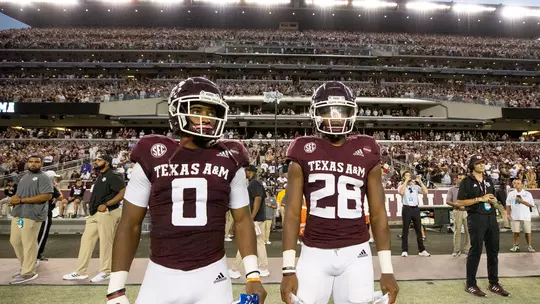 Isaiah Spiller and Ainias Smith pregame before the coin toss