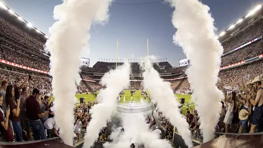 Wide Shot of Team Run Out with Smoke Kyle Field