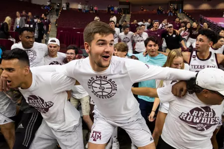 COLLEGE STATION, TX - November 10, 2021 - Forward Everett Vaughn #12 of the Texas A&M Aggies and student sections fans during the game between the North Florida Ospreys and the Texas A&M Aggies at Reed Arena in College Station, TX. Photo By Olivia Treadwell/Texas A&M Athletics
