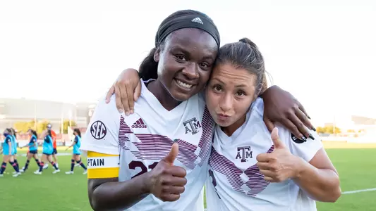 Karlina Sample and Barbara Olivieri celebrate after winning SEC regular-season title.