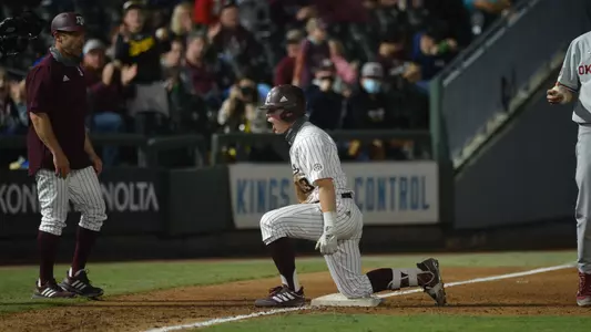 Zane Schmidt celebrates a triple against Oklahoma