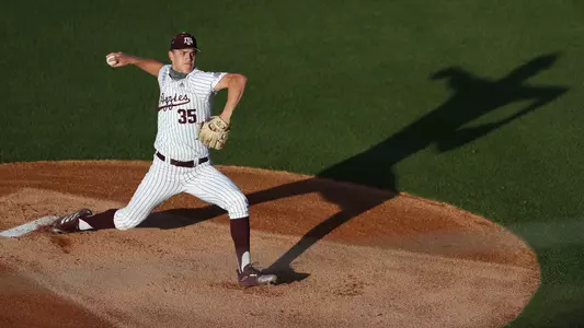 Nathan Dettmer casts a long shadow as he delivers a pitch against the Rice Owls