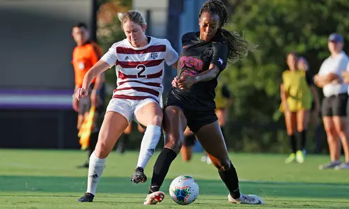 Kate Colvin battles a TCU player for the ball at Garvey-Rosenthal Stadium