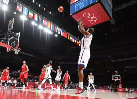 SAITAMA, JAPAN - JULY 28: Khris Middleton #8 of Team United States attempts a three point shot against Iran during a Men's Preliminary Round Group A game on day five of the Tokyo 2020 Olympic Games at Saitama Super Arena on July 28, 2021 in Saitama, Japan. (Photo by Matthias Hangst/Getty Images)