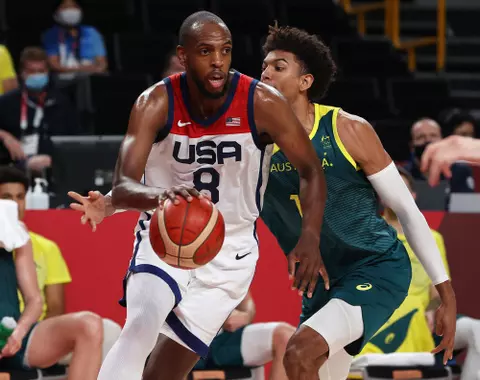 SAITAMA, JAPAN - AUGUST 05: Khris Middleton #8 of Team United States drives to the basket against Matisse Thybulle #10 of Team Australia during the second half of a Men's Basketball quarterfinals game on day thirteen of the Tokyo 2020 Olympic Games at Saitama Super Arena on August 05, 2021 in Saitama, Japan. (Photo by Kevin C. Cox/Getty Images)