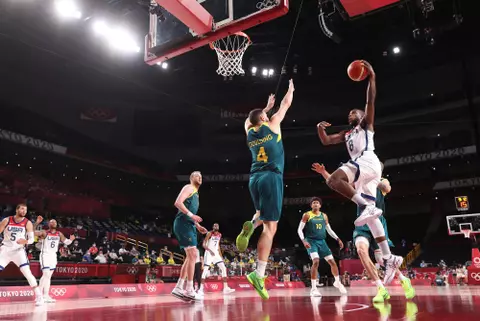 SAITAMA, JAPAN - AUGUST 05: Khris Middleton #8 of Team United States goes up for a shot against Chris Goulding #4 of Team Australia during the first half of a Men's Basketball quarterfinals game on day thirteen of the Tokyo 2020 Olympic Games at Saitama Super Arena on August 05, 2021 in Saitama, Japan. (Photo by Gregory Shamus/Getty Images)