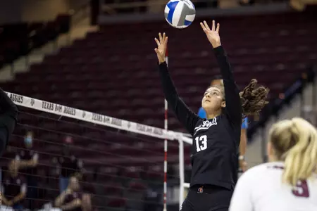 COLLEGE STATION, TX - September 11, 2021 - Setter Nisa Buzlutepe #13 of the Texas A&M Aggies during the game between the Albany Great Danes and the Texas A&M Aggies at Reed Arena in College Station, TX. Photo By Kate Luffman/Texas A&M Athletics