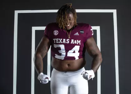 COLLEGE STATION, TX - July 27, 2021 - Defensive lineman Isaiah Raikes #34 of the Texas A&M Aggies during Texas A&M Aggies Football photo day in College Station, TX. Photo By Craig Bisacre/Texas A&M Athletics