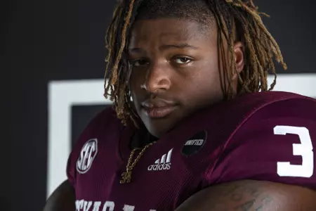 COLLEGE STATION, TX - July 27, 2021 - Defensive lineman Isaiah Raikes #34 of the Texas A&M Aggies during Texas A&M Aggies Football photo day in College Station, TX. Photo By Craig Bisacre/Texas A&M Athletics