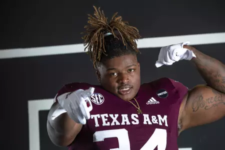COLLEGE STATION, TX - July 27, 2021 - Defensive lineman Isaiah Raikes #34 of the Texas A&M Aggies during Texas A&M Aggies Football photo day in College Station, TX. Photo By Craig Bisacre/Texas A&M Athletics