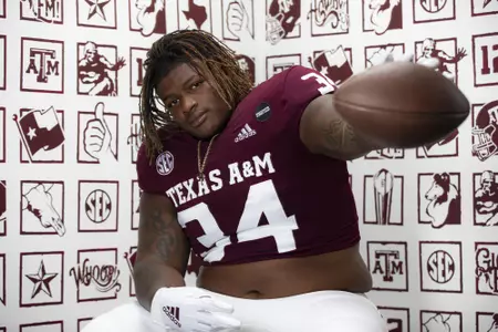 COLLEGE STATION, TX - July 27, 2021 - Defensive lineman Isaiah Raikes #34 of the Texas A&M Aggies during Texas A&M Aggies Football photo day in College Station, TX. Photo By Craig Bisacre/Texas A&M Athletics