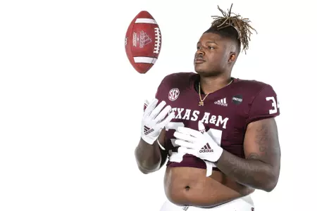 COLLEGE STATION, TX - July 27, 2021 - Defensive lineman Isaiah Raikes #34 of the Texas A&M Aggies during Texas A&M Aggies Football photo day in College Station, TX. Photo By Craig Bisacre/Texas A&M Athletics/Texas A&M Athletics