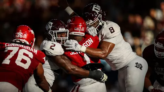 Micheal Clemons and DeMarvin Leal sack Arkansas QB.