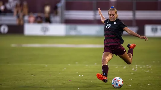 Lauren Geczik is in full back swing on a left-footed free kick.