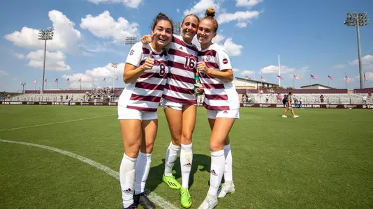 COLLEGE STATION, TX - September 11, 2022 - Forward Maile Hayes #8 of the Texas A&M Aggies and Defender Carolyn Calzada #16 of the Texas A&M Aggies and Defender Mia Pante #13 of the Texas A&M Aggies during the game between the South Alabama Jaguars and the Texas A&M Aggies at Ellis Field in College Station, TX. Photo By Evan Pilat/Texas A&M Athletics