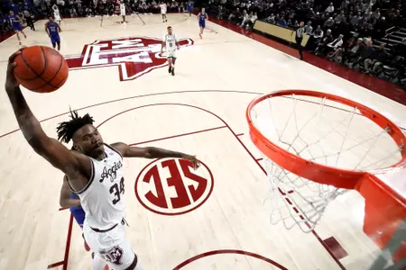 COLLEGE STATION, TX - November 30, 2022 - Forward Julius Marble #34 of the Texas A&M Aggies during the Men's Basketball game between the SMU Mustangs and the Texas A&M Aggies at Reed Arena in College Station, TX. Photo By Craig Bisacre/Texas A&M Athletics