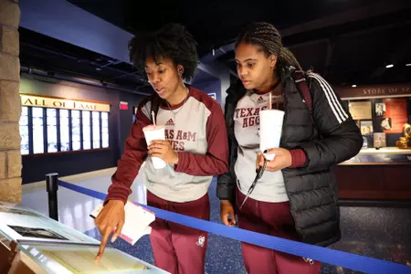 LAWRENCE, KS - November 30, 2022 - Forward Maliyah Johnson #14 of the Texas A&M Aggies and Forward Jada Malone #13 of the Texas A&M Aggies during the game between the Kansas Jayhawks and the Texas A&M Aggies at Allen Fieldhouse in Lawrence, KS. Photo By Ethan Mito/Texas A&M Athletics
