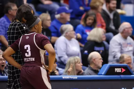 LAWRENCE, KS - November 30, 2022 - Head Coach Joni Taylor of the Texas A&M Aggies and Guard Tineya Hylton #3 of the Texas A&M Aggies during the game between the Kansas Jayhawks and the Texas A&M Aggies at Allen Fieldhouse in Lawrence, KS. Photo By Ethan Mito/Texas A&M Athletics