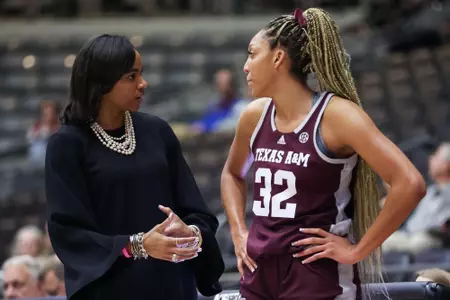 LITTLE ROCK, AR - December 06, 2022 - Head Coach Joni Taylor of the Texas A&M Aggies and Forward Aaliyah Patty #32 of the Texas A&M Aggies during the game between the Little Rock Trojans and the Texas A&M Aggies at Jack Stephens Center in Little Rock, AR. Photo By Ethan Mito/Texas A&M Athletics