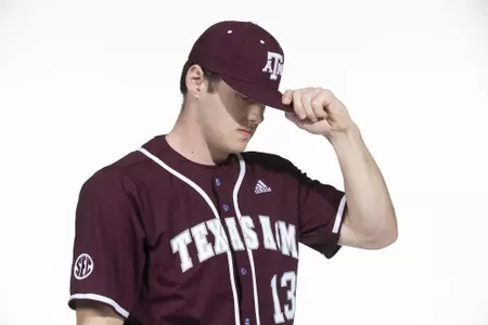 COLLEGE STATION, TX - January 12, 2022 - right hand pitcher/outfielder Robert Hogan #13 of the Texas A&M Aggies during the Texas A&M Aggies 2022 Baseball Photo Day in The Studio in Kyle Field College Station, TX. Photo By Craig Bisacre/Texas A&M Athletics