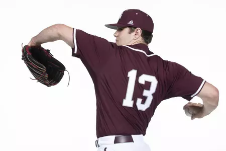 COLLEGE STATION, TX - January 12, 2022 - right hand pitcher/outfielder Robert Hogan #13 of the Texas A&M Aggies during the Texas A&M Aggies 2022 Baseball Photo Day in The Studio in Kyle Field College Station, TX. Photo By Craig Bisacre/Texas A&M Athletics