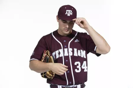 COLLEGE STATION, TX - January 12, 2022 - right hand pitcher Micah Dallas #34 of the Texas A&M Aggies during the Texas A&M Aggies 2022 Baseball Photo Day in The Studio in Kyle Field College Station, TX. Photo By Craig Bisacre/Texas A&M Athletics