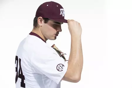 COLLEGE STATION, TX - January 12, 2022 - right hand pitcher Micah Dallas #34 of the Texas A&M Aggies during the Texas A&M Aggies 2022 Baseball Photo Day in The Studio in Kyle Field College Station, TX. Photo By Craig Bisacre/Texas A&M Athletics