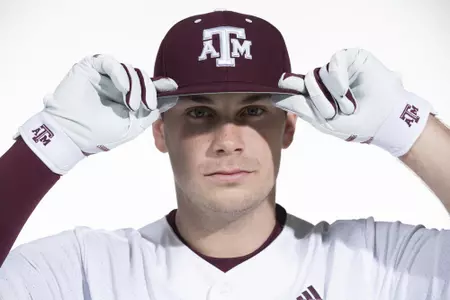 COLLEGE STATION, TX - January 12, 2022 - infielder Austin Bost #11 of the Texas A&M Aggies during the Texas A&M Aggies 2022 Baseball Photo Day in The Studio in Kyle Field College Station, TX. Photo By Craig Bisacre/Texas A&M Athletics