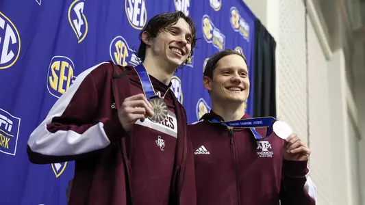 Ethan Gogulski and Anze Fers Erzen medal at SEC Championships