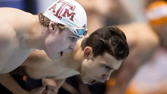 Clayton Bobo and Koko Bratanov cheering on the 800 free relay at SEC Championships